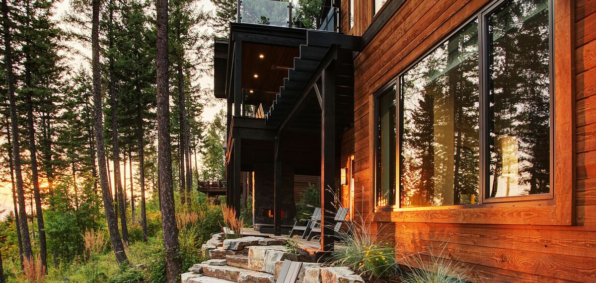 Sunset on private home in the woods, featuring aluminium windows.